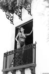 Hypnotizing brunette Sunny Leone in exciting black lingerie on the balcony